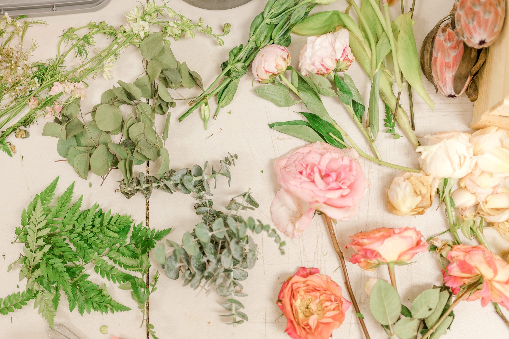 Fresh wedding bouquet flowers getting ready to be pressed for a modern bouquet preservation