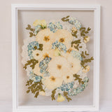 White 16x20 vertical frame with pressed flower burst of flowers design