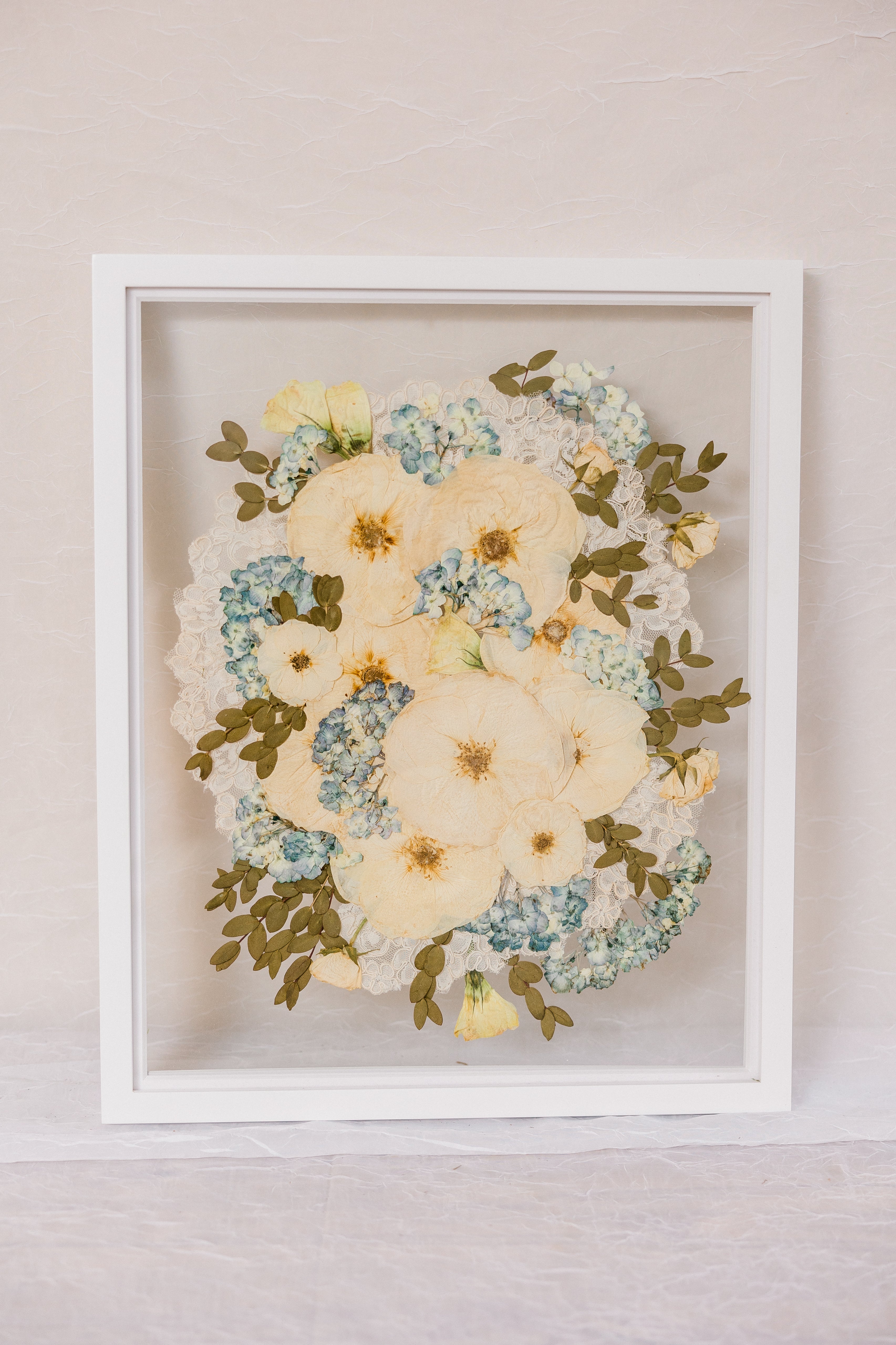 White 16x20 vertical frame with pressed flower burst of flowers design