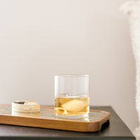 Wooden resin tray with a beverage on nightstand