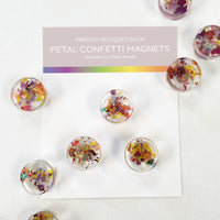 Rainbow-colored petal confetti refrigerator magnets