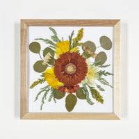 Finished summer solstice workshop pressed floral design in a natural 10x10" frame
